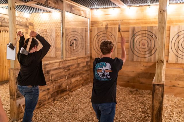 two men axe throwing in Forks, Maine