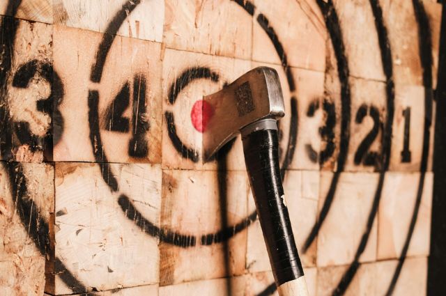 axe embedded into a wood target
